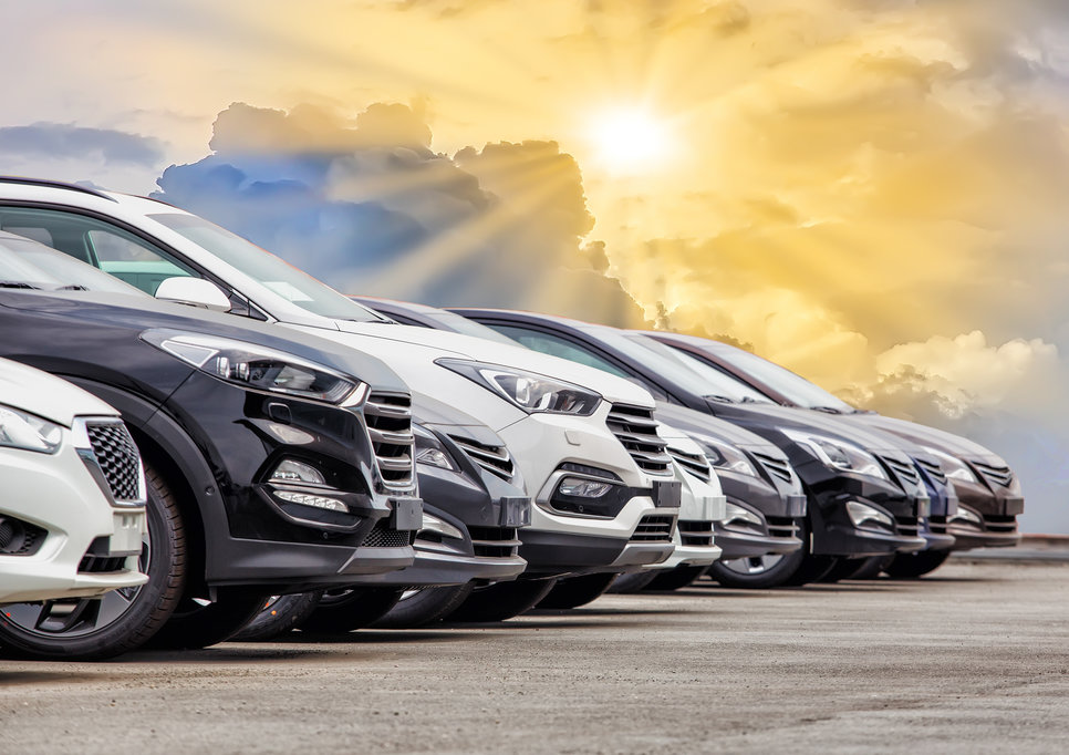 Row of family vehicles at dealership showcasing different options for Georgia families